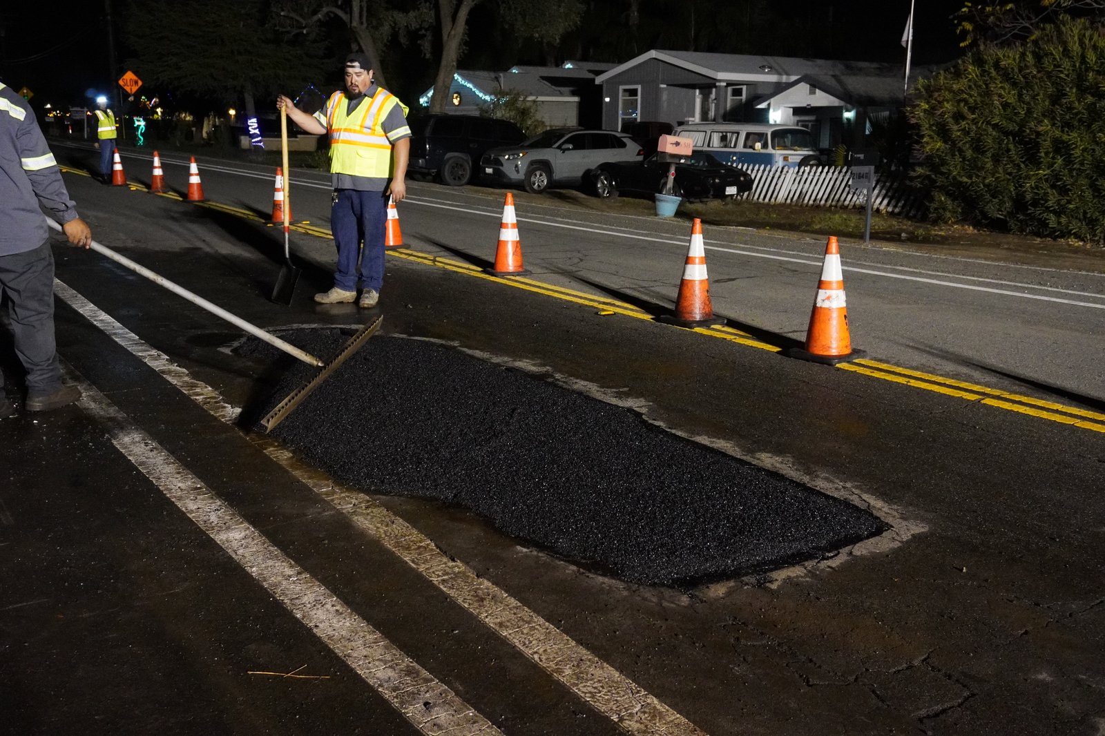 Fresh hot-mix asphalt patch installed on emergency call